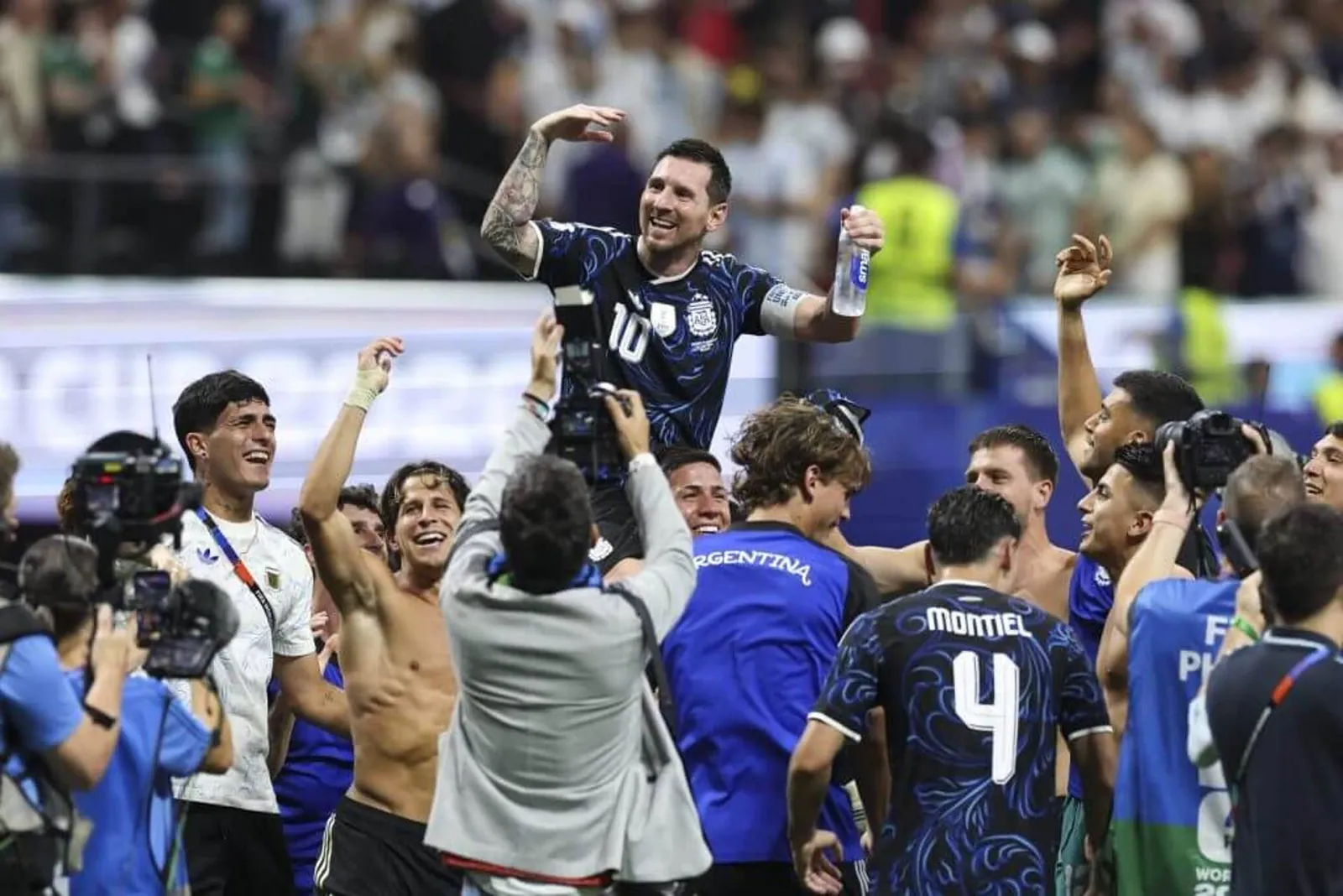 Lionel Messi is carried by his Argentina team-mates after helping them to a second straight World Cup final and third out of four