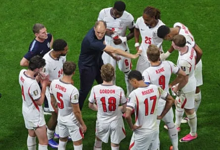 England’s head coach Thomas Tuchel talks to players during the first hydration break