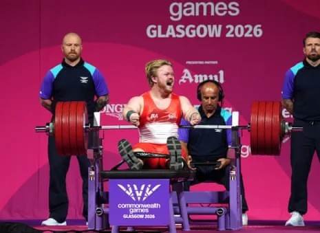 Mark Swan of England celebrates after a successful lift to win the first gold medal of the Games in the men’s lightweight para-powerlifting.