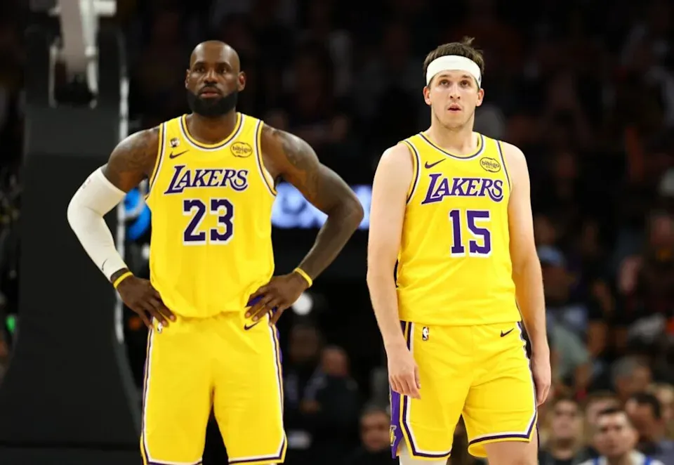 Los Angeles Lakers guard Austin Reaves (15) with forward LeBron James (23) against the Phoenix Suns at Mortgage Matchup Center.