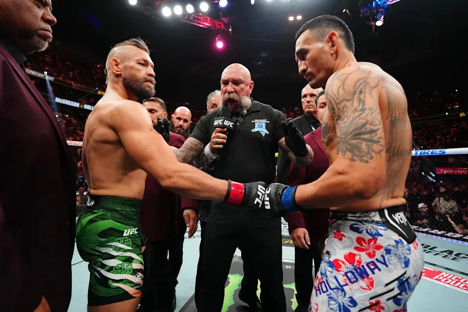 LAS VEGAS, NEVADA - JULY 11: (L-R) Conor McGregor of Ireland touches gloves with Max Holloway in a welterweight fight during the UFC 329 event at T-Mobile Arena on July 11, 2026 in Las Vegas, Nevada. (Photo by Jeff Bottari/Zuffa LLC)