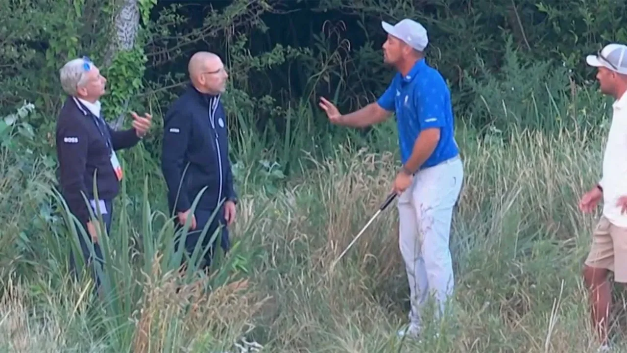 A golfer in a blue shirt gestures and talks to three men, two in jackets and one in white, while standing in tall grass near bushes. The scene appears tense or serious, possibly during a dispute on a golf course.