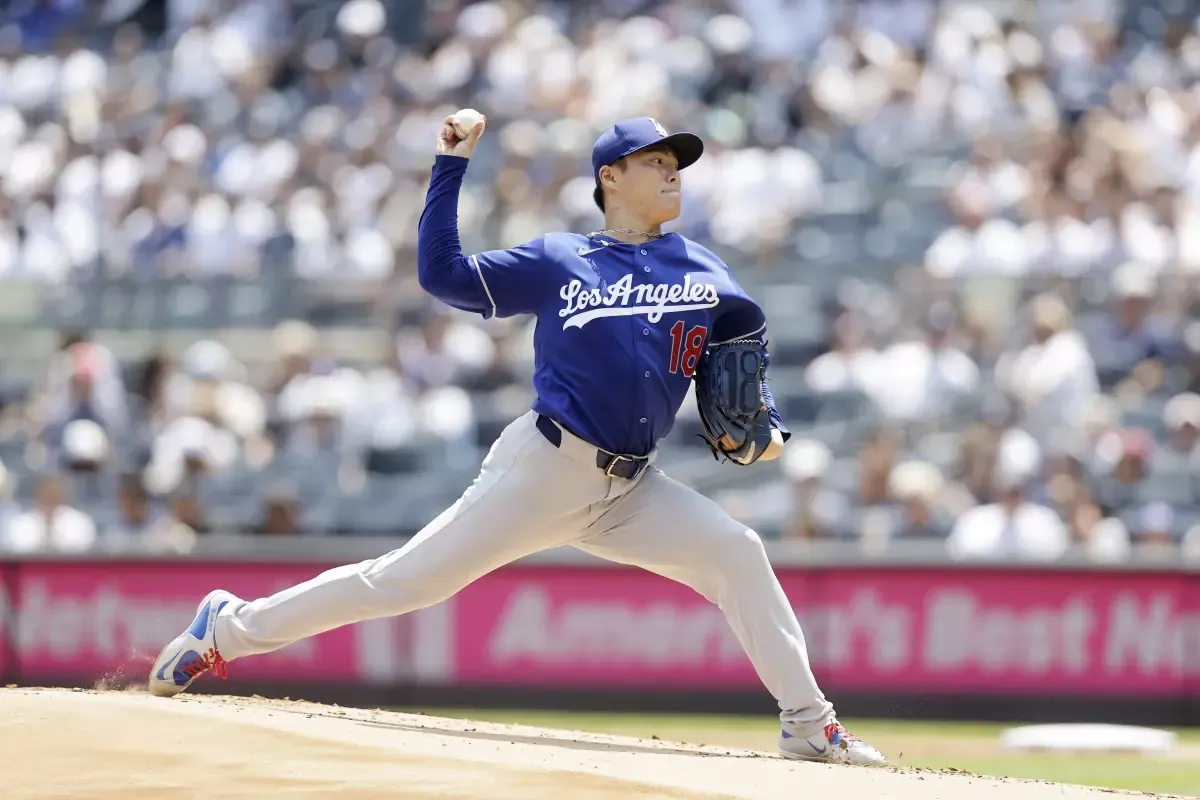 Dodgers pitcher Yoshinobu Yamamoto delivers during the first inning against the Yankees on Sunday.