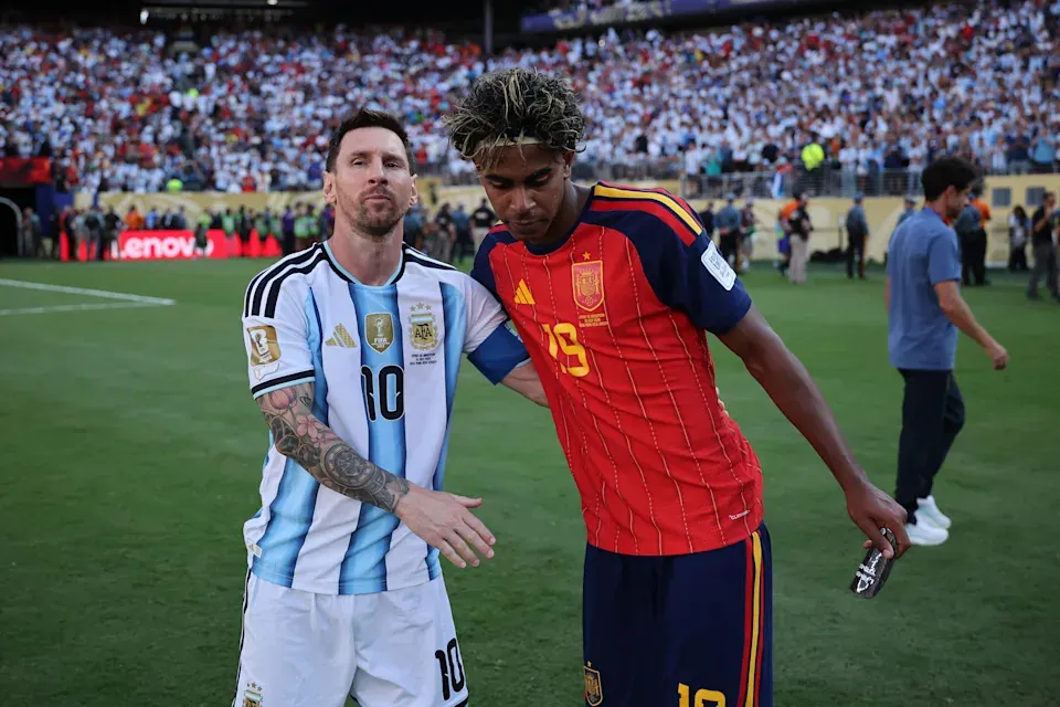 Lamine Yamal #19 of Spain is congratulated by Lionel Messi #10 of Argentina after the World Cup Final.