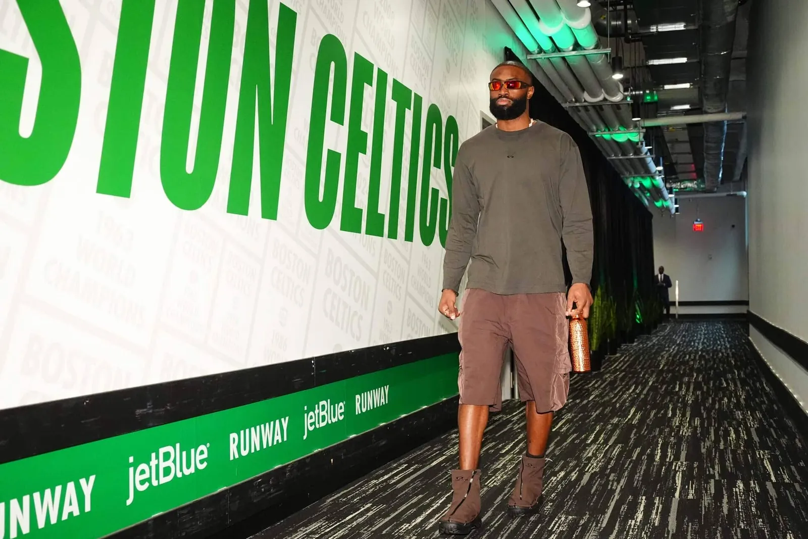 Boston Celtics forward Jaylen Brown walks down a corridor at TD Garden before an NBA game.