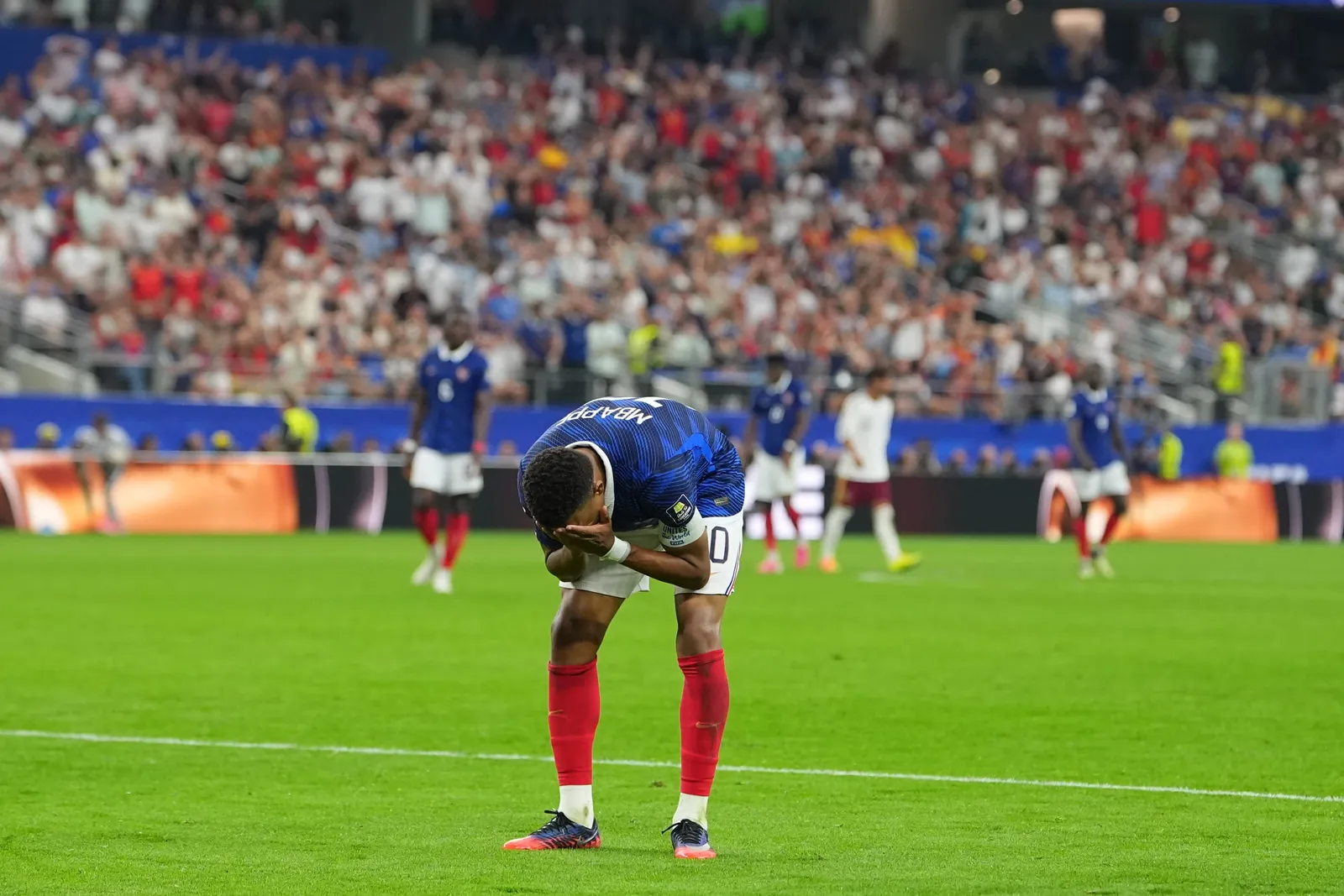 France's Kylian Mbappe reacts during a World Cup semifinal soccer match against Spain in Arlington, Texas, near Dallas, Tuesday, July 14, 2026. (AP Photo/Julio Cortez)