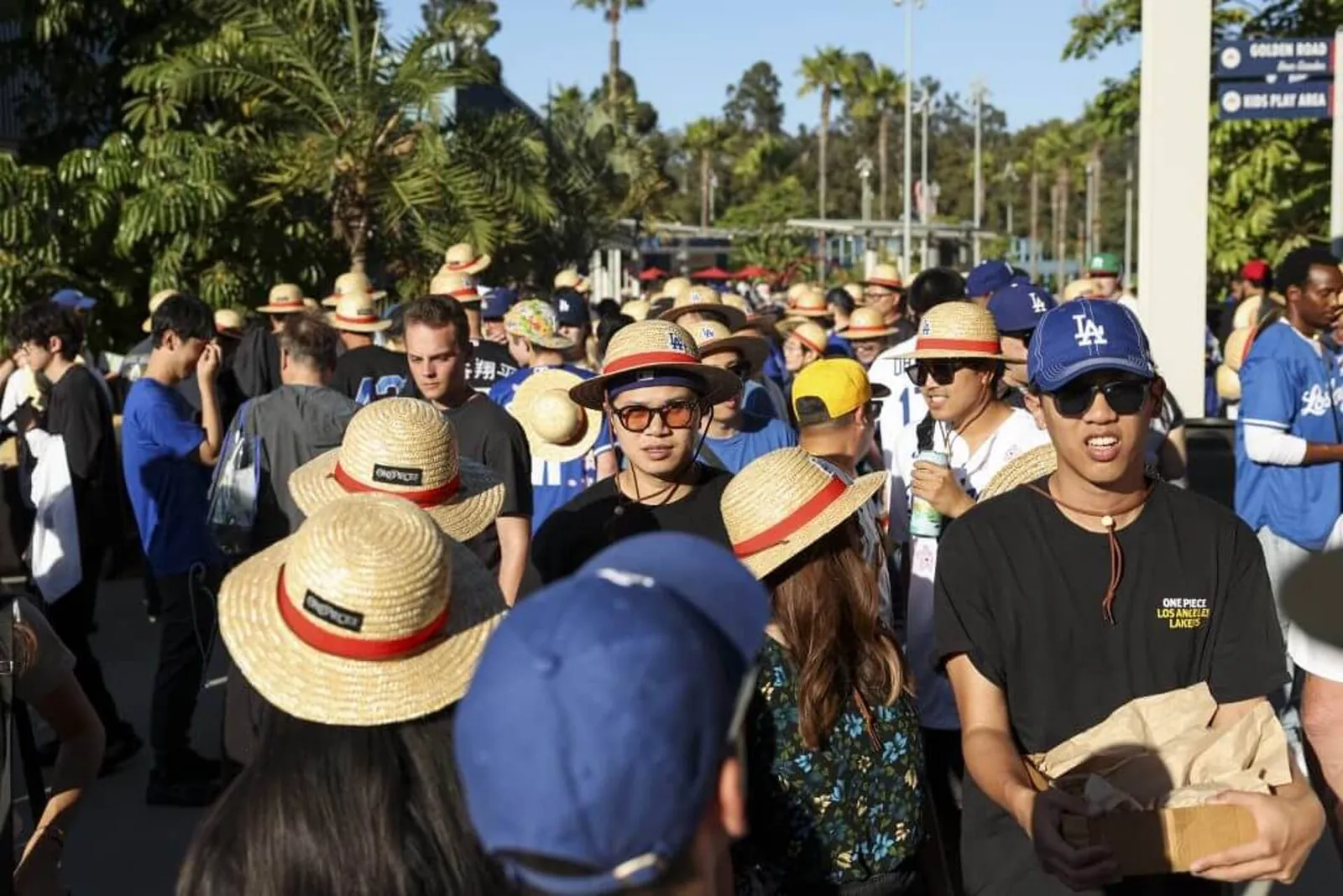 A crowd of fans wear One Piece giveaway hats as part of One Piece Night.