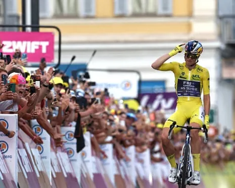 Demi Vollering gestures in celebration as she rolls towards the Tour de France Femmes finish line in NIce.