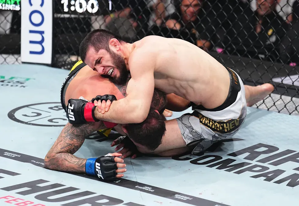 INGLEWOOD, CALIFORNIA - JANUARY 18: Islam Makhachev of Russia secures a submission against Renato Moicano of Brazil in the UFC lightweight championship fight during the UFC 311 event at Intuit Dome on January 18, 2025 in Inglewood, California. (Photo by Jeff Bottari/Zuffa LLC)